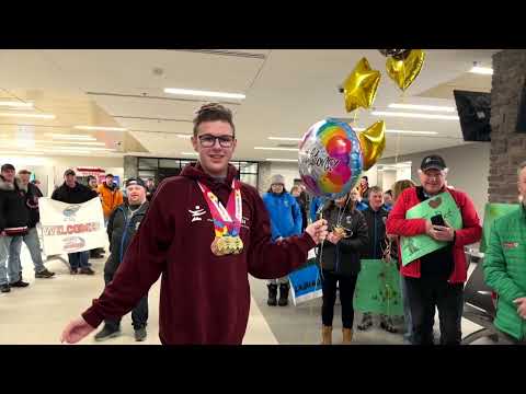 A champion’s welcome home for Labrador athlete Colin Rumbolt [Video]