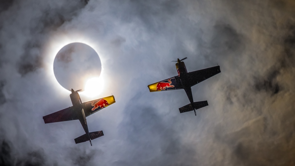 Red Bull pilots fly during eclipse [Video]