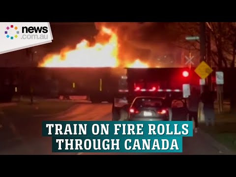 Train on fire rolls through city in Canada [Video]