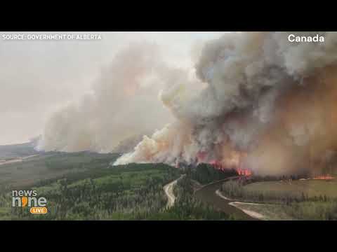 Canada Wildfire | Dangerous Smoke Cloud | Canadian Crews battle wildfire in remote town | News9 [Video]