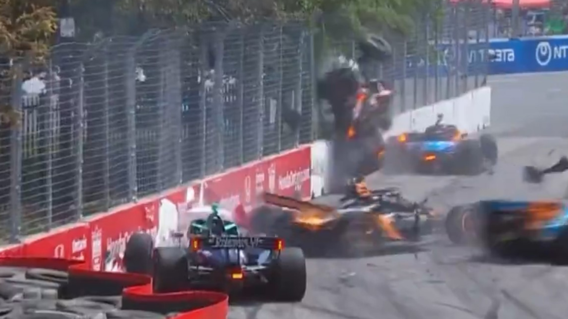 IndyCar driver launched into fence in huge multi-car crash as Toronto race red-flagged to clear debris-filled street [Video]