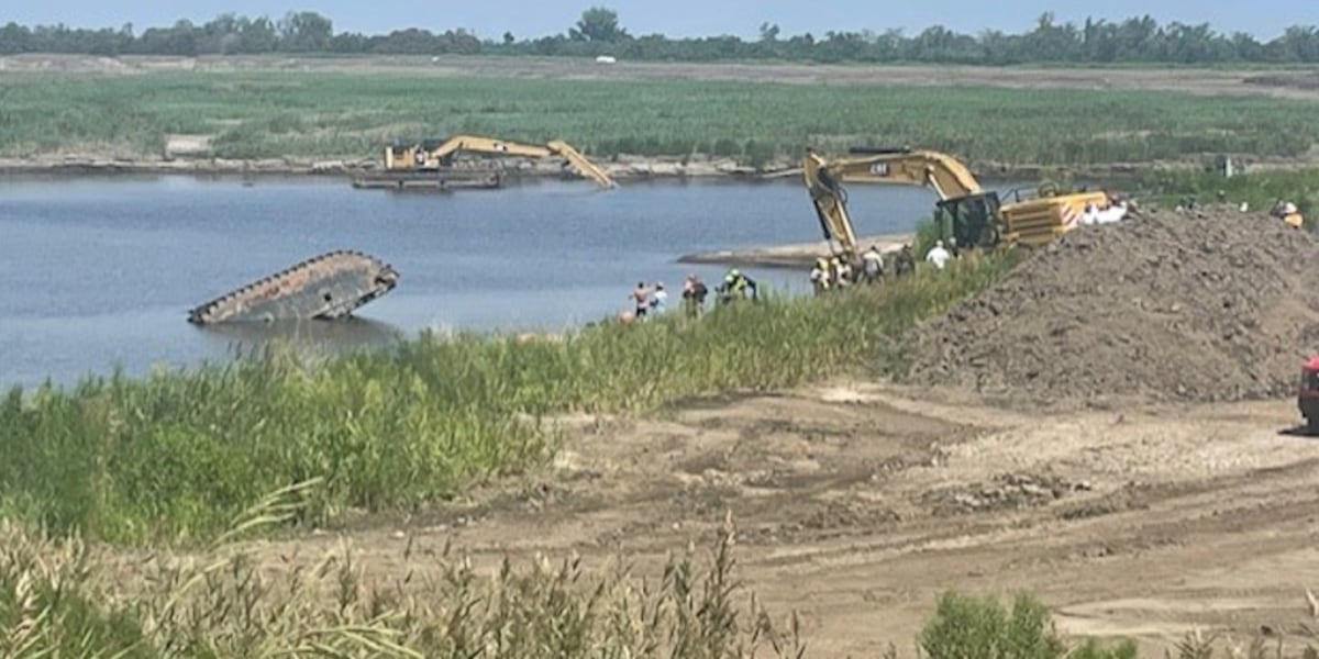 Crews working to rescue person after excavator falls into water [Video]