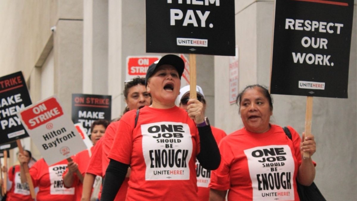 US: More Than 10,000 Hotel Workers In Eight Cities Strike For Better Pay And Working Conditions [Video]