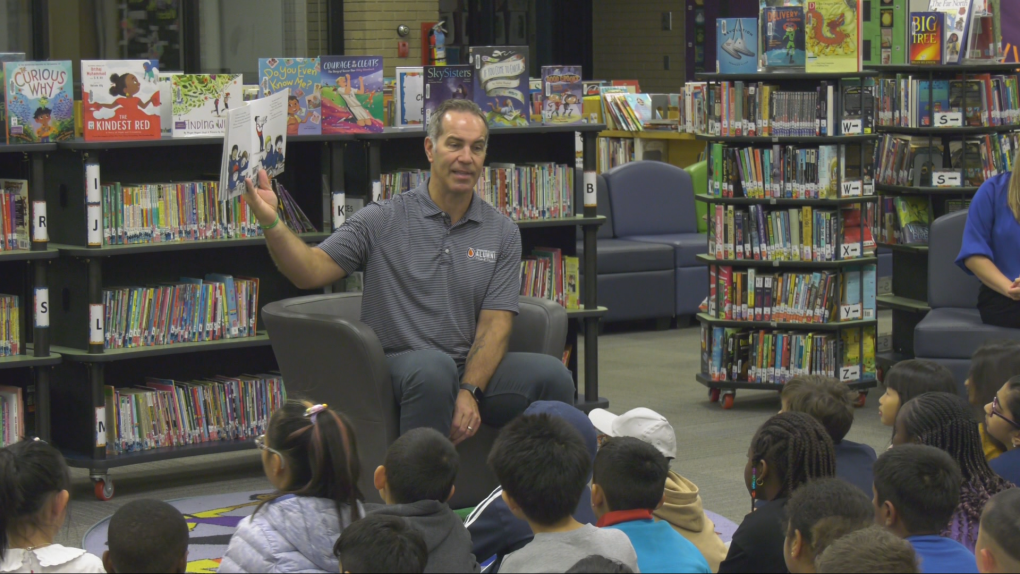 Chris Joseph reads to class for Read-In Week [Video]