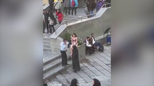 Iranian woman strips to underwear at university in apparent protest, video appears to show