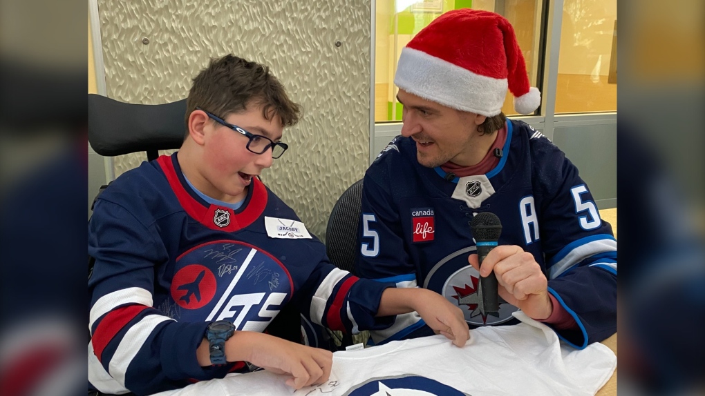 Winnipeg Jets players visit kids for the holidays [Video]