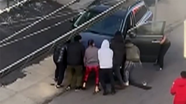 WATCH: Strangers save elderly woman pinned under car [Video]