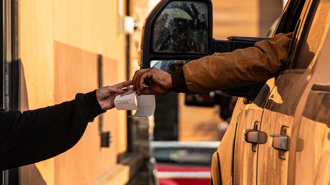 Drive-thru workers taking pictures of customer cards & using them [Video]