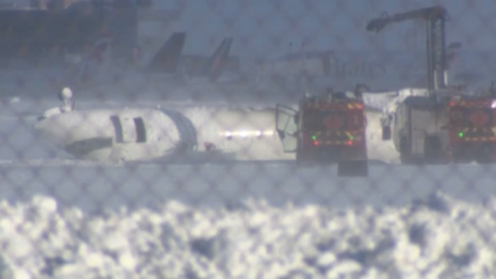 Video: Delta plane lies upside-down after Toronto airport crash | News [Video]