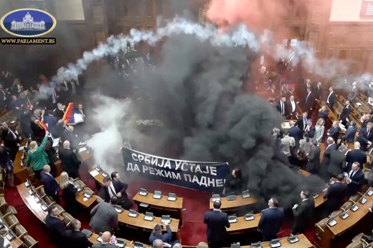 Serbian opposition lawmakers toss smoke grenades in parliament; lawmaker suffers stroke [Video]