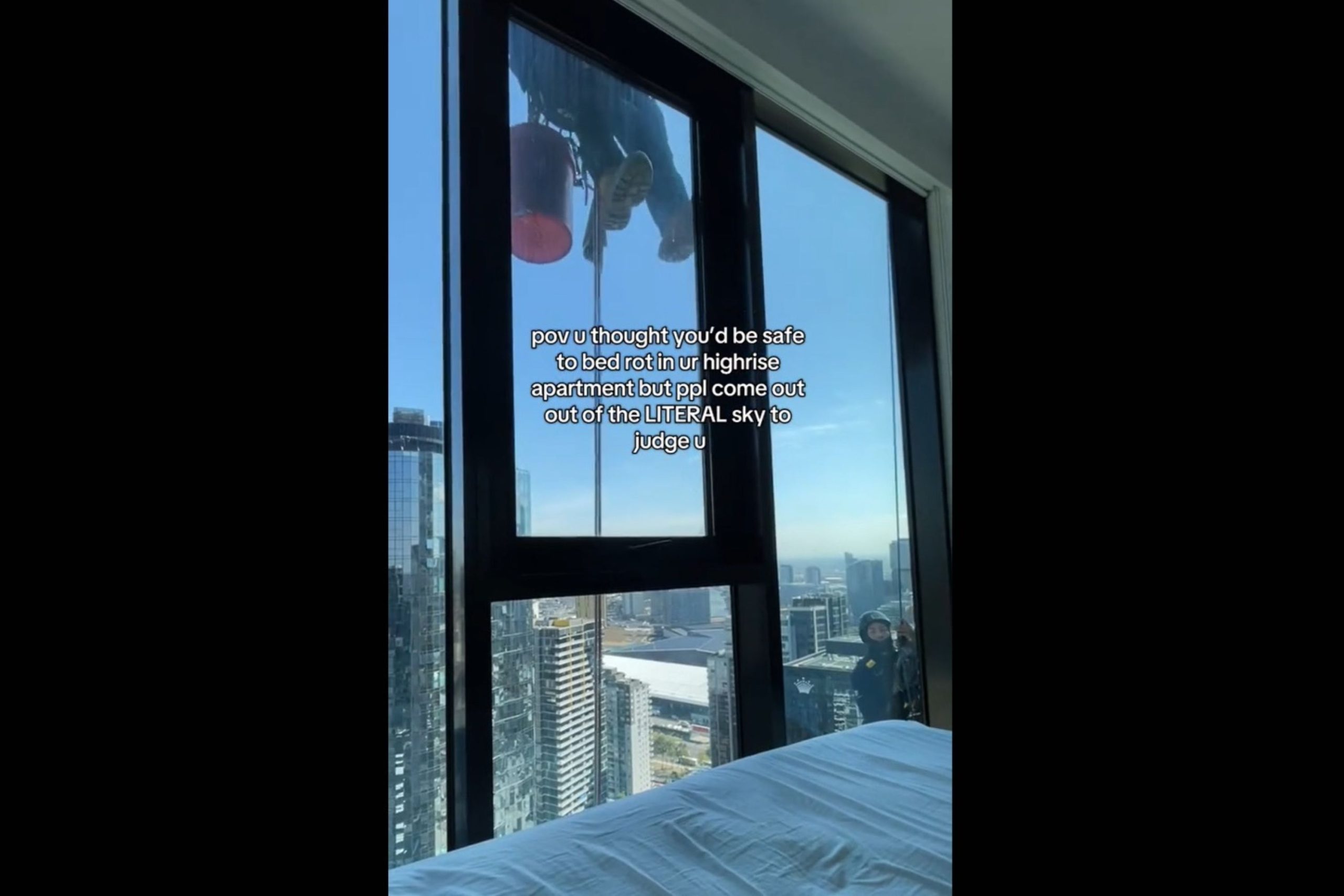Woman Relaxes in High-Rise BedroomThen Sees Someone at the Window [Video]